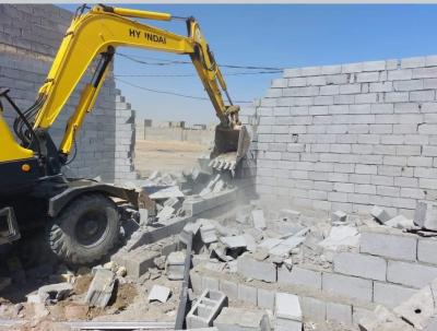 لجنة التجاوزات ترفع دور سكنية قيد الانشاء في منطقة حي الحسين